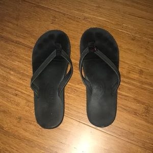 Black rainbow flip flops